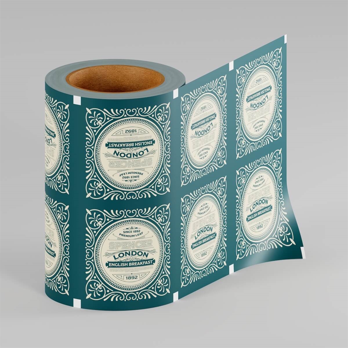 A roll of custom-printed packaging film unwinding to show a repeating vintage-style London label design, displayed against a gray background.