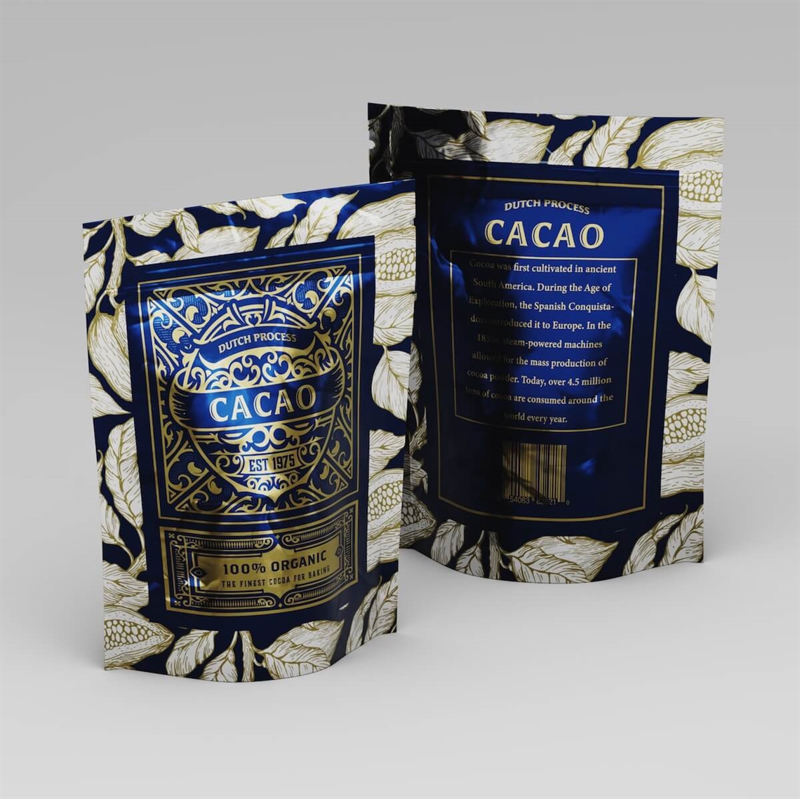 Two dark blue stand-up pouches with gold cacao-themed artwork and botanical leaf print, labeled Cacao, standing upright on a gray surface.