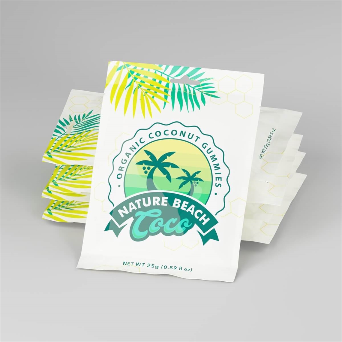 A stack of flat, three-side-seal pouches with a tropical palm tree design labeled Nature Beach Coco — Organic Coconut Gummies, lying flat on a gray surface.